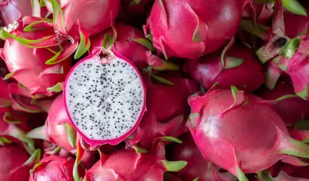 Dragon fruit edible cactus plants that has been cut in half for product display. dragon fruit which are beautifully arranged in baskets to prepare for export sale. Dragon fruit of agriculture product on natural background