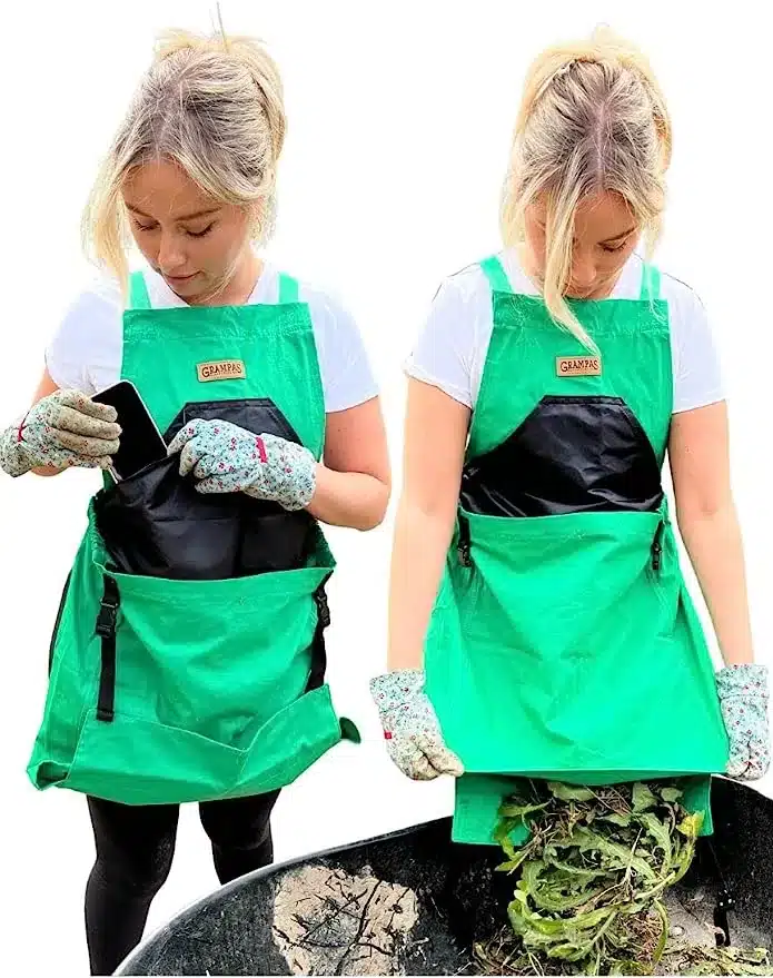 2 Beautiful young blonde ladies wearing a green and black gardening apron