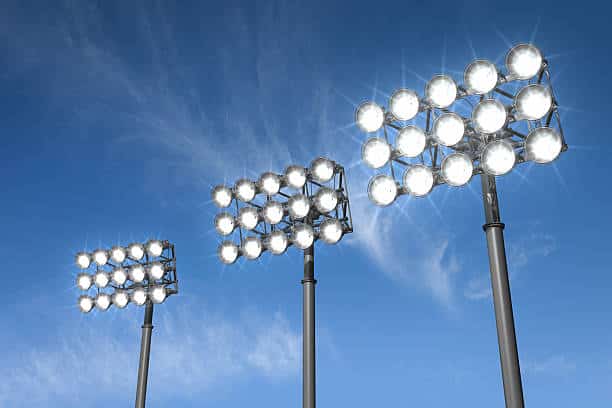 Large stadium lights on a sky background.Could be a useful element in a sports composition.This is a detailed 3d rendering.